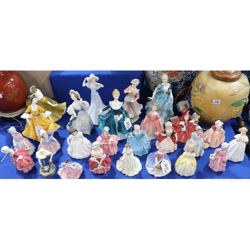 269 - A collection of Royal Doulton figures of ladies and girls 