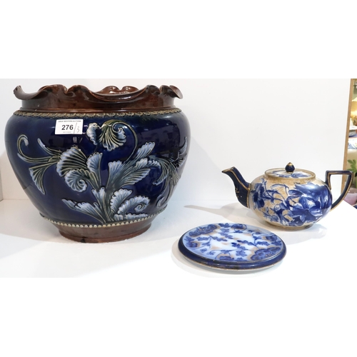 276 - A Doulton Burslem blue and gilt decorated teapot and stand, together with a tube line decorated jard... 