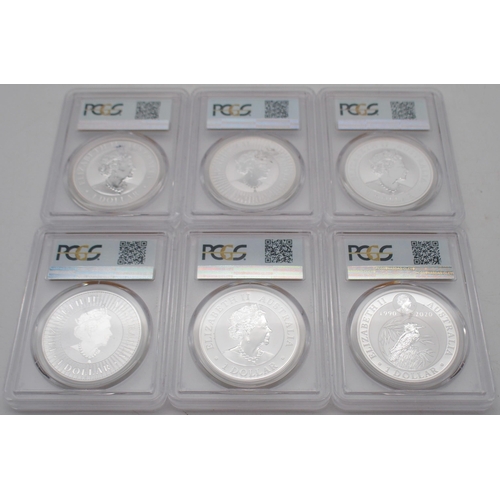 415 - Australian silver commemorative coin sets in wood display cases, each containing three silver coins.... 