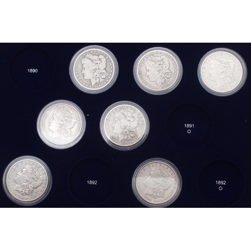 424 - The Ultimate Morgan Silver Dollar Collection, part set with forty seven Morgan Dollars in a wood col... 