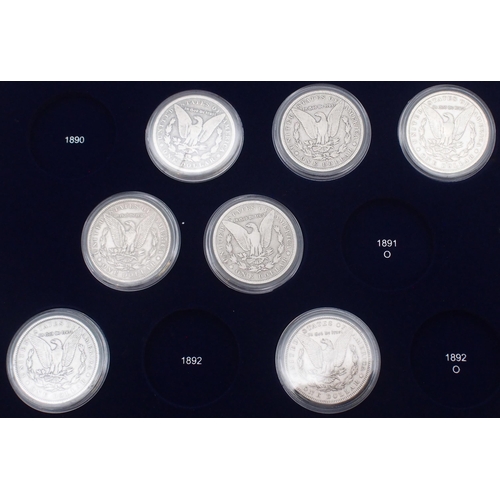 424 - The Ultimate Morgan Silver Dollar Collection, part set with forty seven Morgan Dollars in a wood col... 