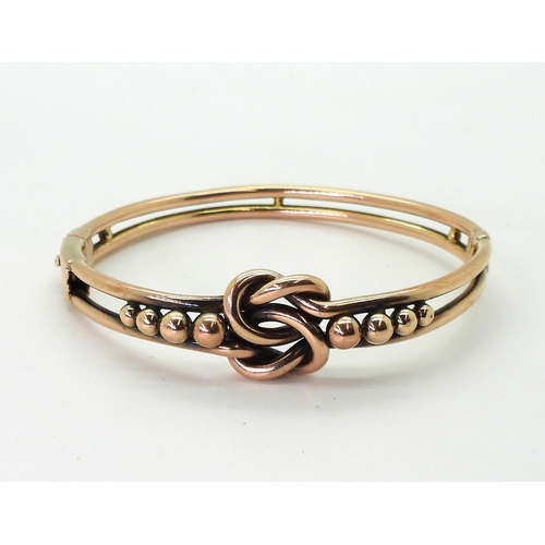 716 - A 9ct gold knot pattern vintage bangle, inner diameter 5.8cm, weight 15.2gms