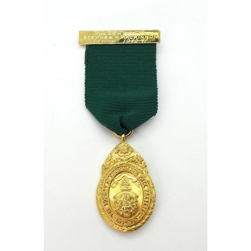 721 - A 9ct gold medallion for The Society of Deacons and Free Preseses. Presented to Stephen H. Mackinon ... 