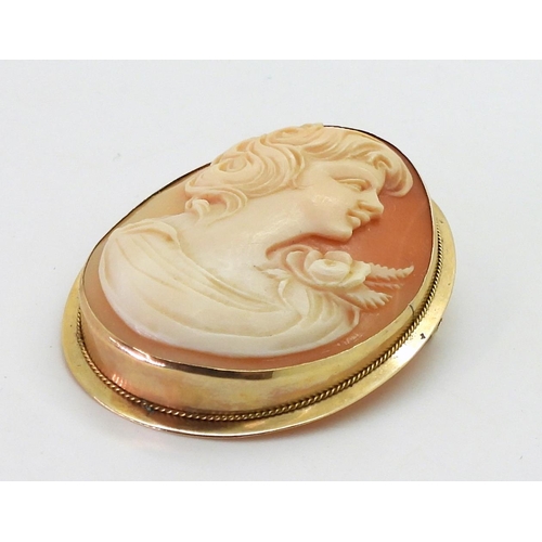 722 - A large shell cameo, in a 14k pendant brooch mount, dimensions 5cm x 3.8cm, weight 9.2gms