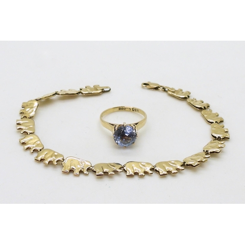 723 - A 9ct gold, blue gem ring, size K, and a 9ct gold elephant bracelet, weight together 7.6gms