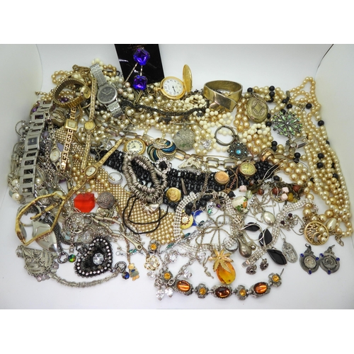 819 - A silver and amber necklace, two silver boxing medallions, a St. Andrew's Ambulance Association meda... 