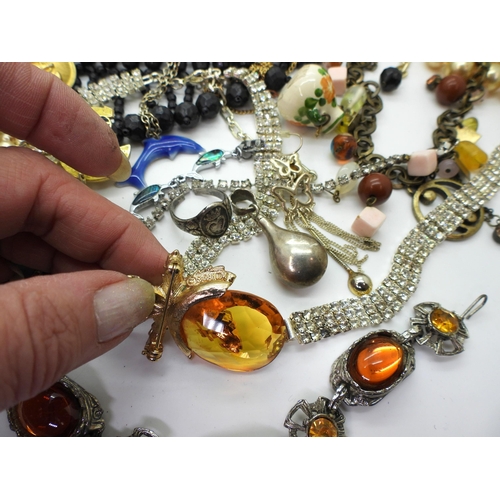 819 - A silver and amber necklace, two silver boxing medallions, a St. Andrew's Ambulance Association meda... 