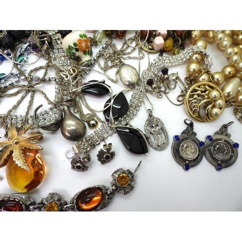 819 - A silver and amber necklace, two silver boxing medallions, a St. Andrew's Ambulance Association meda... 