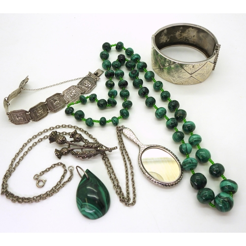 826 - A string of malachite beads, a wide silver engraved bangle hallmarked Birmingham 1883, a silver moun... 