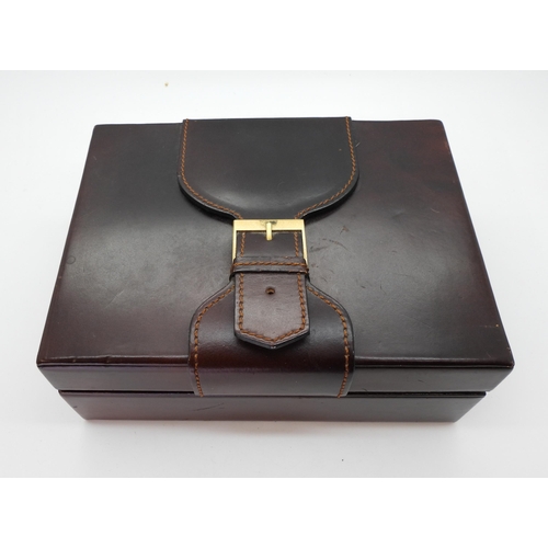 832 - A brown leather and wood veneer Rolex box, with decorative buckle, inside the lid branded Creation G... 