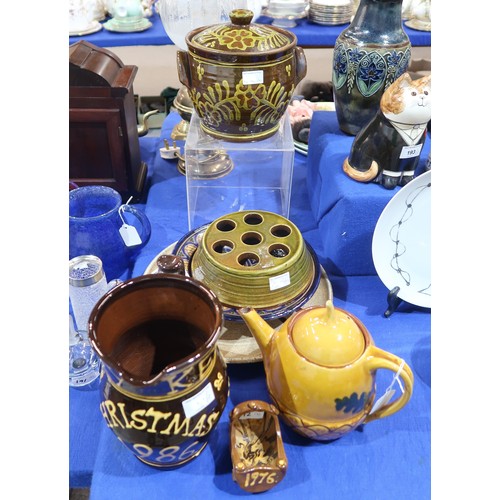 218 - A slipware jug titled Christmas 1986, a model of a child's cot dated 1976, other slipware and studio... 