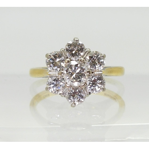 2766 - AN 18CT GOLD DIAMOND FLOWER RING set with estimated approx 1.30cts of brilliant cut diamonds, finger... 