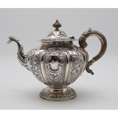 2430 - AN EARLY VICTORIAN SCOTTISH SILVER TEAPOTby Milne & Campbell, Edinburgh 1841, of lobed form, wit... 