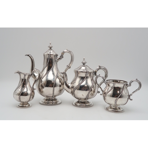 2439 - A MATCHED FOUR PIECE SILVER TEA SERVICEthe hot water pot and cream jug by Robert Hennell II, London ... 