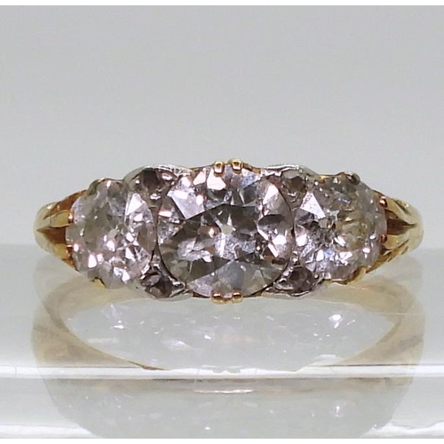 2757 - AN 18CT GOLD THREE STONEset with estimated approx 1.20cts of old cut diamonds, the claws are set wit... 