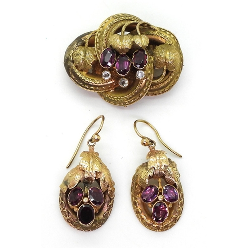 2759 - A GERMAN GEM SET BROOCH & EARRINGSset with foiled back garnets and clear gems, with a botanical ... 