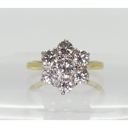 2766 - AN 18CT GOLD DIAMOND FLOWER RING set with estimated approx 1.30cts of brilliant cut diamonds, finger... 