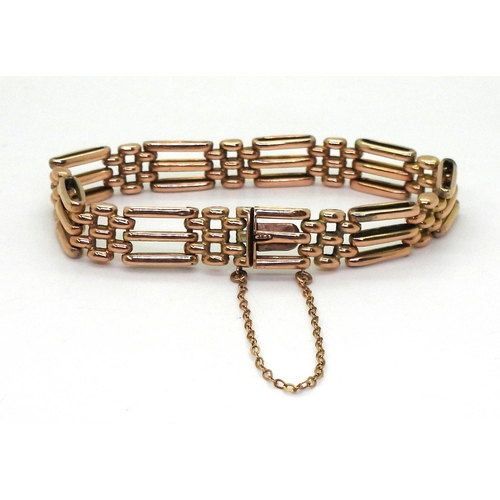 2771 - A ROSE GOLD GATE BRACELETmade in 9ct gold the fancy links have a box clasp stamped 9ct. Length 18cm,... 