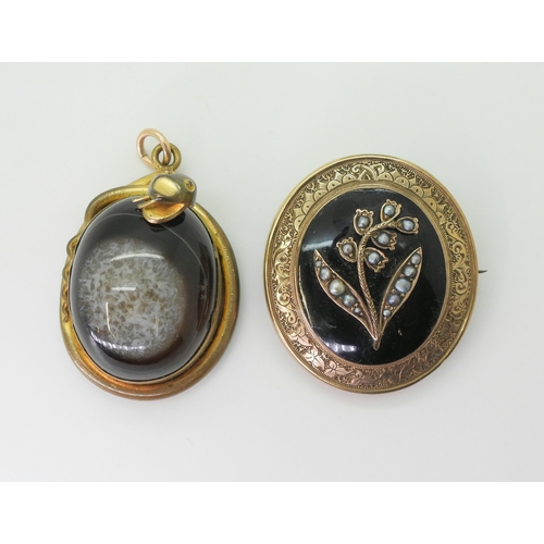 2791 - TWO VICTORIAN JEWELSa yellow metal brooch with a locket back, black enamelled front panel depicting ... 