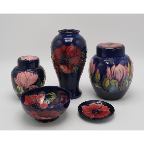 2183 - A COLLECTION OF MOORCROFT POTTERYincluding two Magnolia pattern ginger jars, one with an anemone pat... 