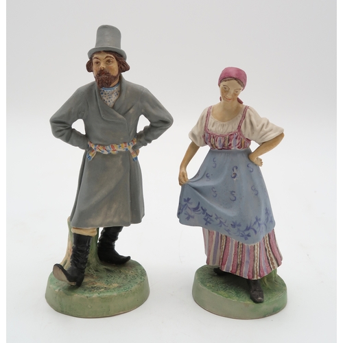 2193 - A PAIR OF RUSSIAN BISQUE FIGURESmodelled as a man and woman dancing, in the style of Gardner, impres... 