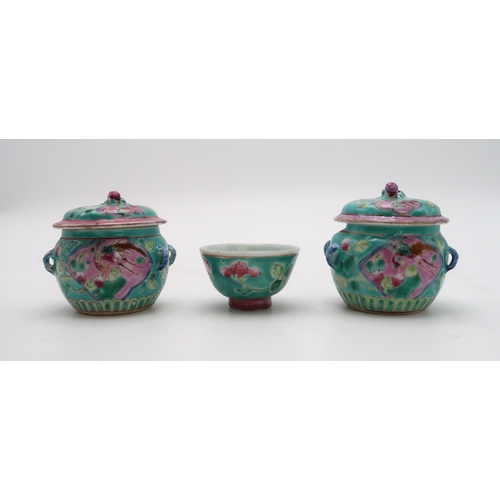 2324 - TWO CHINESE MINIATURE JARS AND COVERS each painted with birds and flowers,with peach finials, 6.5cm ... 