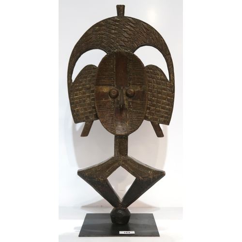 164 - An African wooden mask on stand with brass detailing