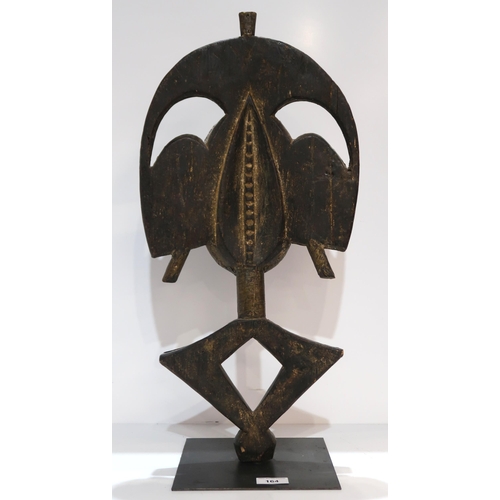 164 - An African wooden mask on stand with brass detailing