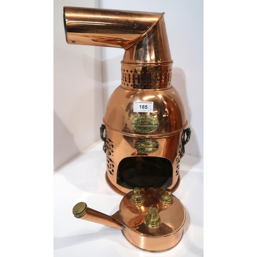 185 - A copper fumigator possibly for bees by J Foot & Sons, London, together with a copper coal scutt... 