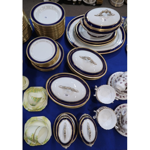 192 - An extensive blue and gilt rimmed dinner service with soup tureen, 2 veg tureens, 2 sauce tureens, 2... 