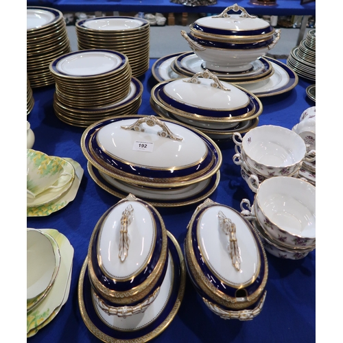 192 - An extensive blue and gilt rimmed dinner service with soup tureen, 2 veg tureens, 2 sauce tureens, 2... 