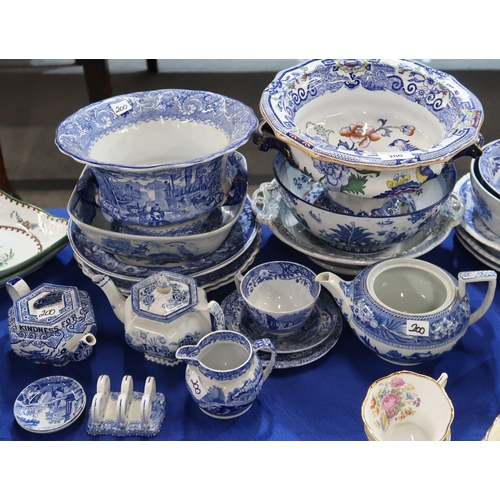 200 - A collection of transfer printed blue and white pottery including platters, punch bowls, dishes , a ... 