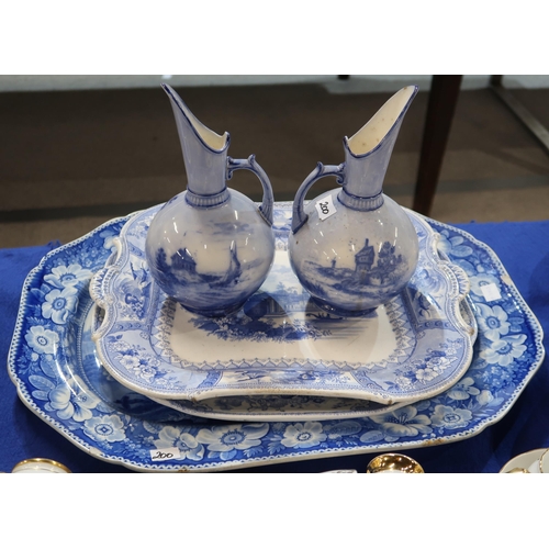 200 - A collection of transfer printed blue and white pottery including platters, punch bowls, dishes , a ... 