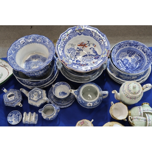 200 - A collection of transfer printed blue and white pottery including platters, punch bowls, dishes , a ... 