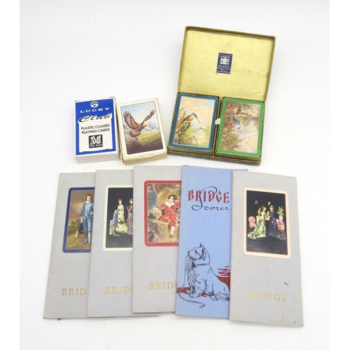 348 - A boxed bridge set, including a variety of vintage playing cards