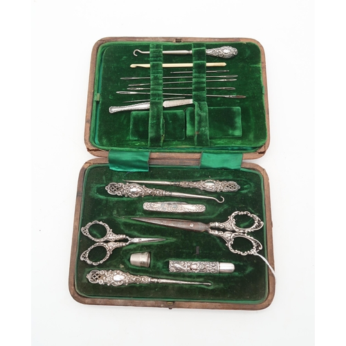 258B - A cased silver and stainless steel sewing kit, by Duncan & Scobie, Birmingham, the file by Levi ... 