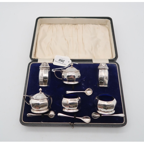 260 - A cased six piece silver cruet set, by GM & Co, Birmingham 1918, of faceted form, 168gms