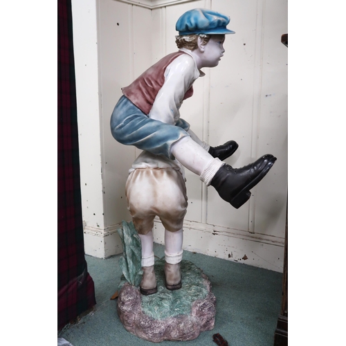 7 - A 20th century resin garden statue depicting young boys playing leapfrog, 108cm high 