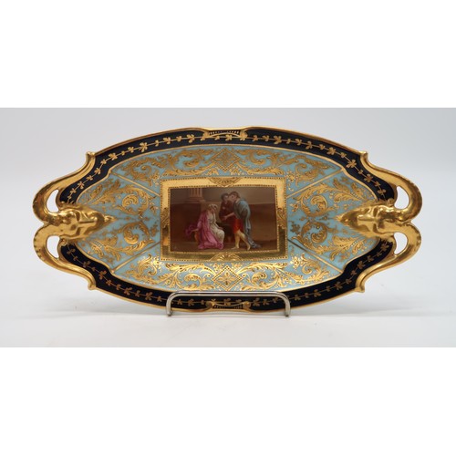 2184 - A VIENNA PORCELAIN DISHwith rams head handles, the centre painted panel of figures surrounded by a p... 