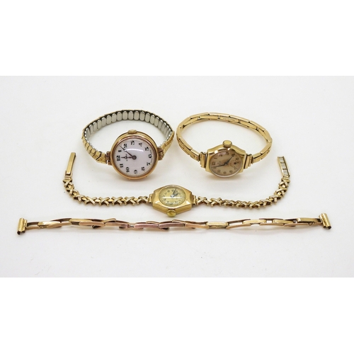 707 - Three ladies 9ct gold watches to include, a Visible with pretty kiss pattern strap, a Smiths with a ... 