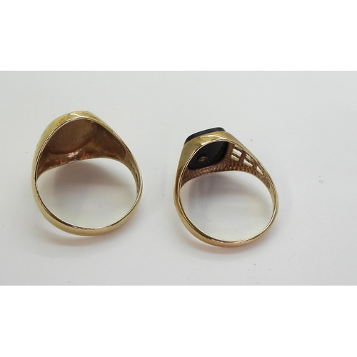 737 - A 9ct gold oval engraved signet ring, size W, together with a 9ct gold onyx 'Playboy Bunny' signet r... 