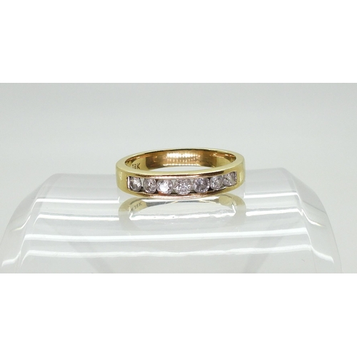 738 - An 18ct gold half eternity ring, set with estimated approx 0.50cts of brilliant cut diamonds, finger... 