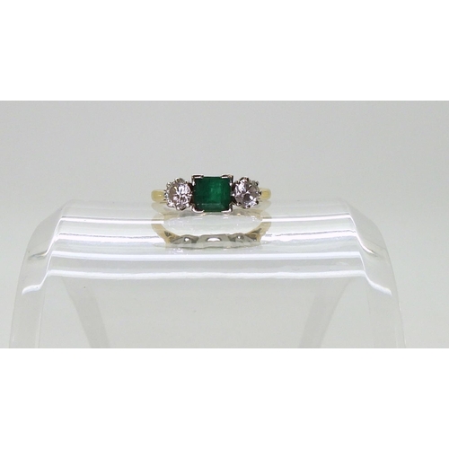 766 - An Emerald and Diamond three-stone ring, mounted in 18ct gold, set with estimated approx 0.40cts bri... 