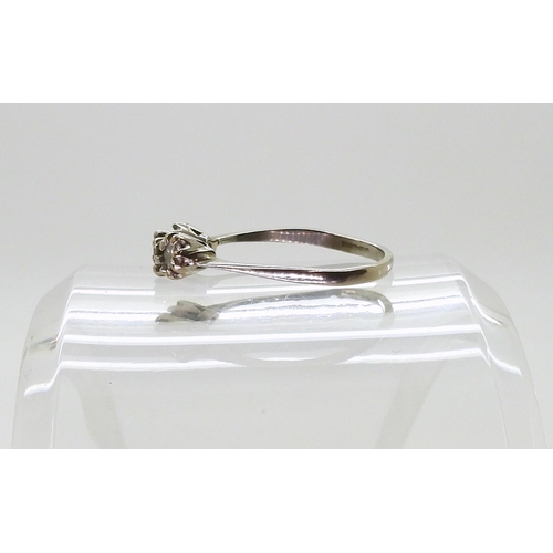 767 - A three-stone diamond ring, mounted in 18ct white gold, size R, set with estimated approx 0.50cts br... 