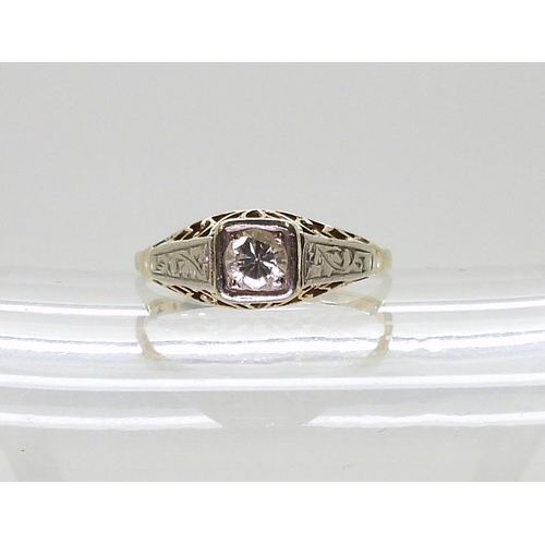 769 - An 18ct gold American style filigree solitaire diamond ring, set with estimated approx 0.20cts brill... 