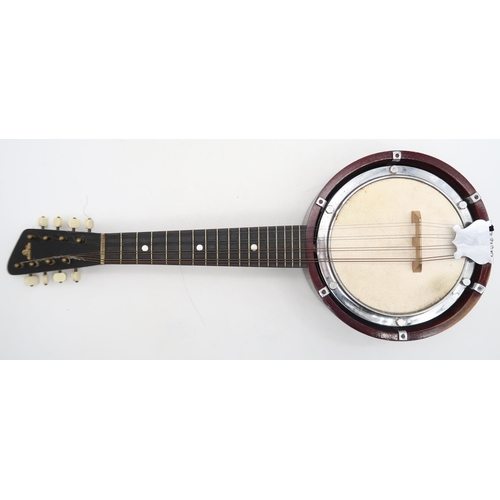 283 - A banjo mandolin 17 frets and marked British Made to the headstock with original case and a tin of p... 