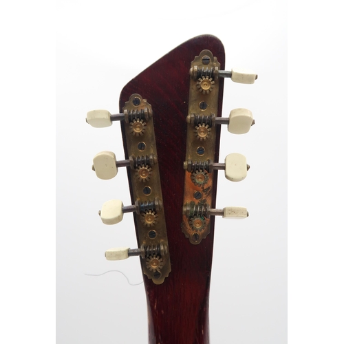 283 - A banjo mandolin 17 frets and marked British Made to the headstock with original case and a tin of p... 