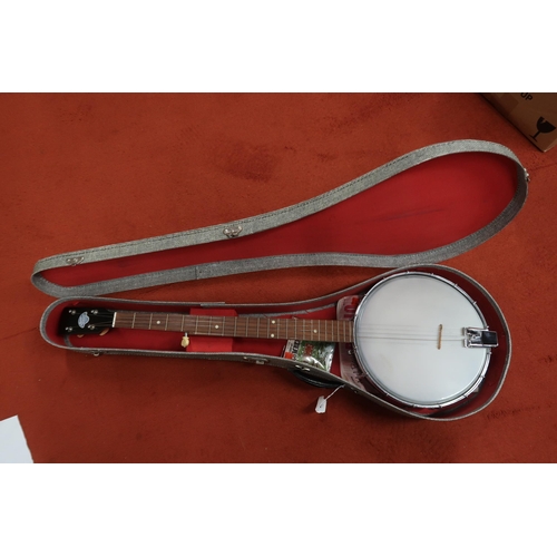 288 - A John Grey & Sons London five string banjo to include various accessories,  finger picks, ... 