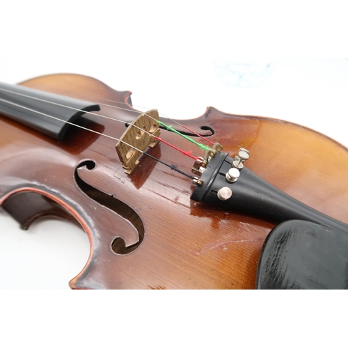 290 - A two piece back violin 35.5cm together with a bow 54 grams and a violin case.