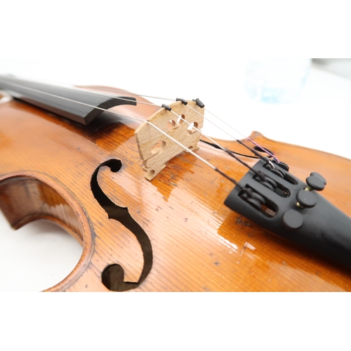 291 - A two piece back violin 32.7cm together with a bow 60grams and a violin case.